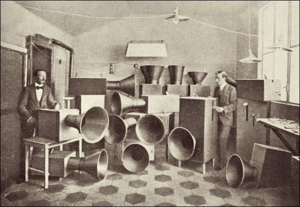 Luigi Russolo (left) and his assistant Ugo Piatti with their 'Intonarumori', 1913 -- 'By selecting, coordinating, and controlling all the noises, we will enrich mankind with a new unsuspected pleasure of the senses.'